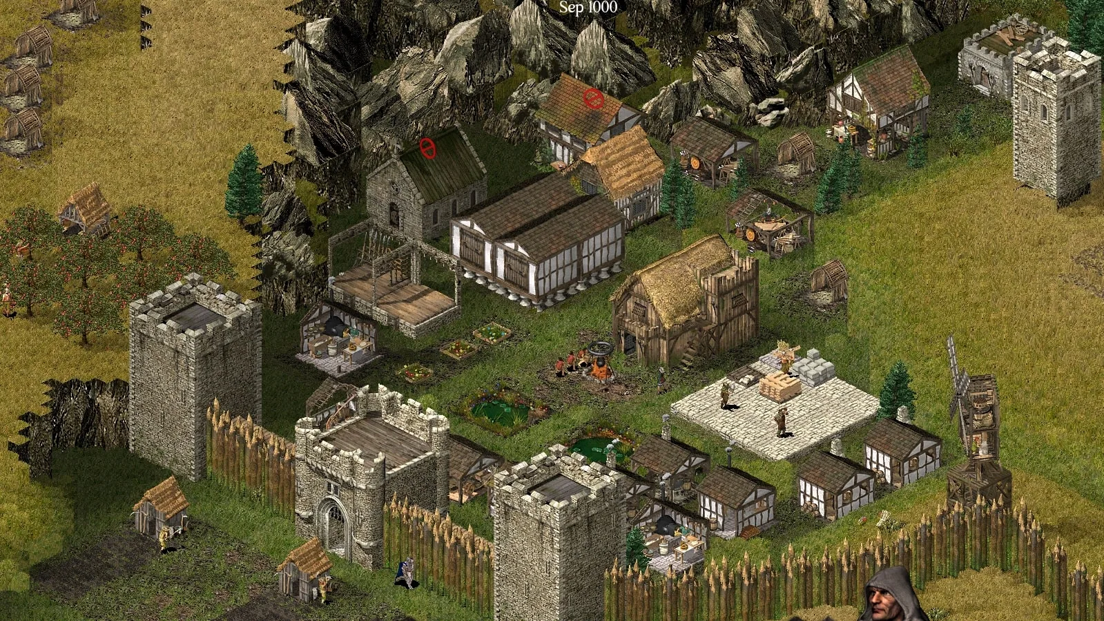 Скриншот стратегии Stronghold с замком и осадой